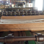 Bottomer for multiwall paper sack production